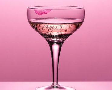 1-close-up-of-pink-champagne-in-glass-andy-roberts